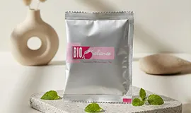Close-up shot of the silver Bio-Balance sachet, featuring a key blend of Oil Palm Fiber, Red Rice, and Soybean Extract to promote gut balance.