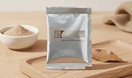 Close-up shot of the silver Bio-Cell sachet, formulated with Carrot Extract, Soybean Extract, Omega-3, and Passion Fruit Extract for cellular support.